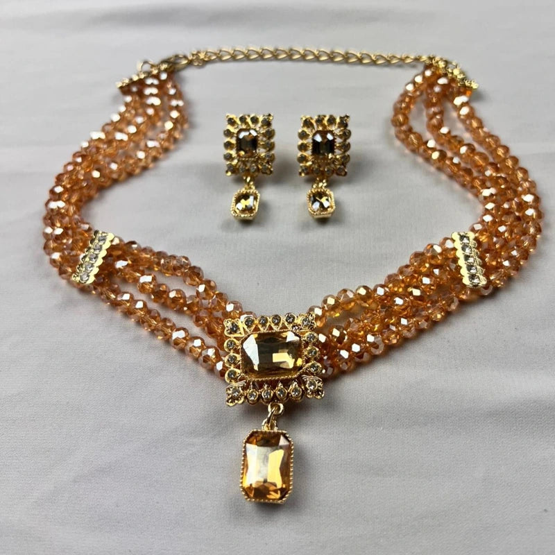 Parure ras de cou orientale dorée avec cristaux champagne et boucles d’oreilles assorties pour mariage et caftan